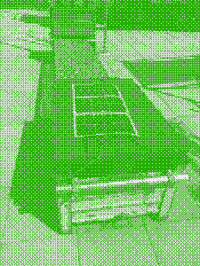Dithered photo of the solar panel on a flat surface on a roof, zip tied down on either end.